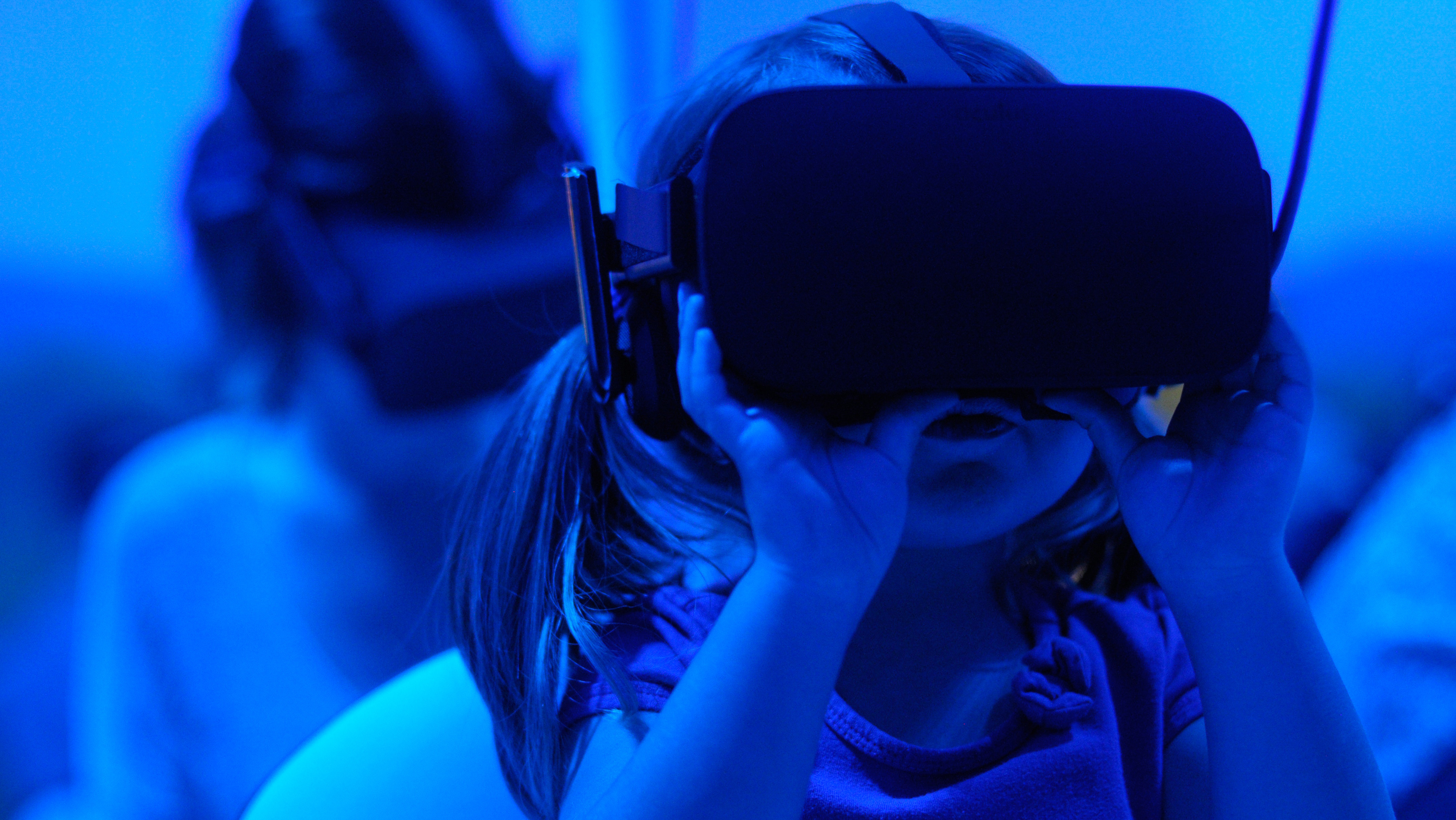 child wearing VR goggles